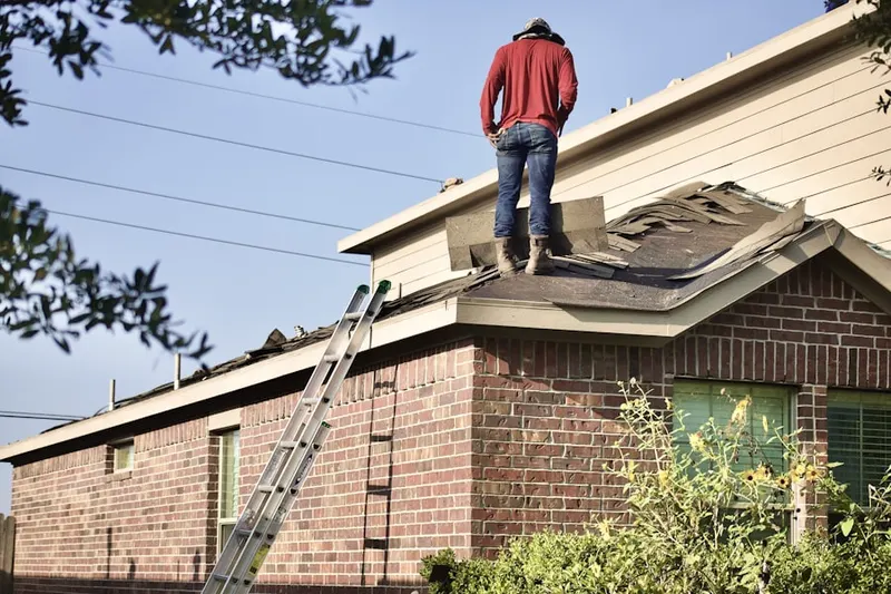 Professional roofer working on a residential roof in Pinyon Hills